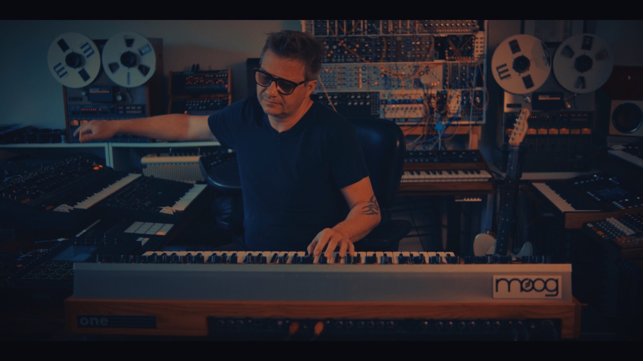 Caught In Joy working in a hardware synthesizer studio
